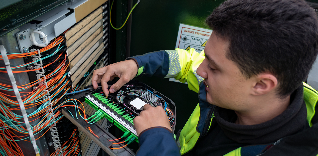 Man fixing telecommunications wiring