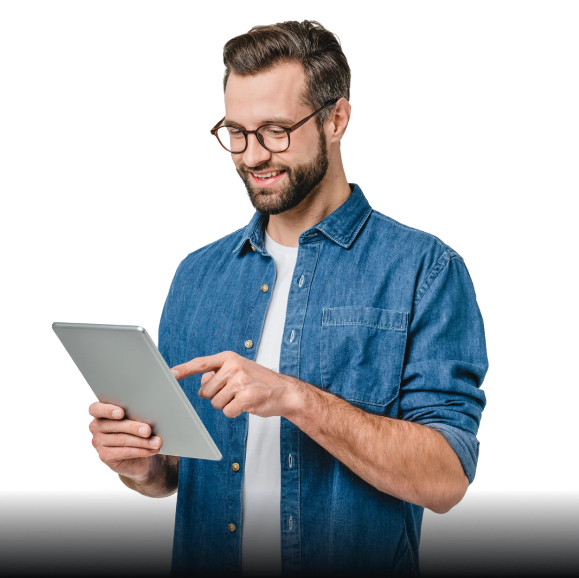 Person in denim shirt with tablet